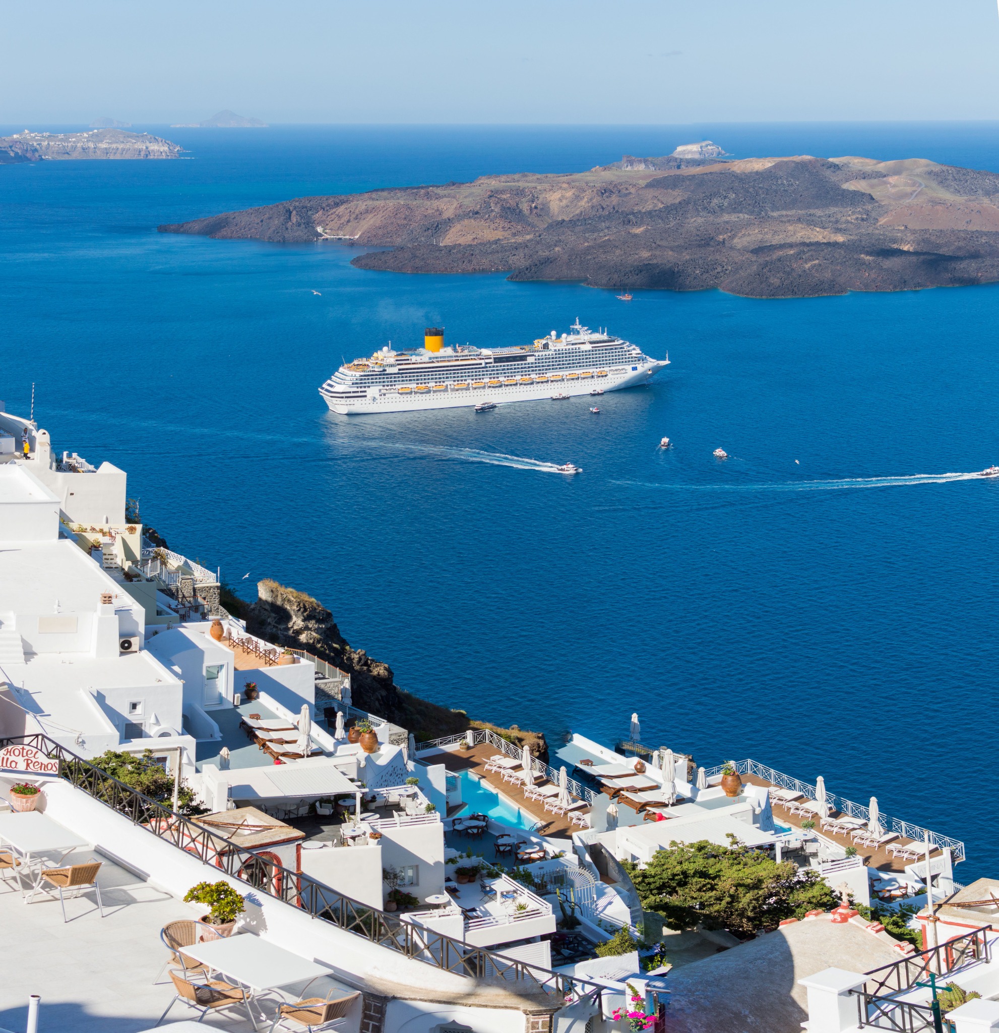 Cruise ship with Mediterranean backdrop